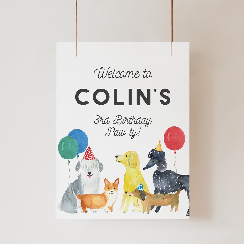 May include: Welcome to Colin's 3rd Birthday Paw-ty! A white sign with black text and colorful illustrations of dogs wearing party hats and holding balloons.