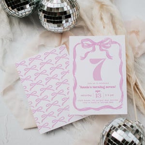 May include: Pink invitation with a pink bow and the number seven. The text reads "Join us to celebrate 'Annie's turning seven!'". The date is Saturday, April 13th, from 2-4 pm. The location is Clark House, 123 Juniper Way, Boulder. RSVP to Kelly at 123.456.7890.