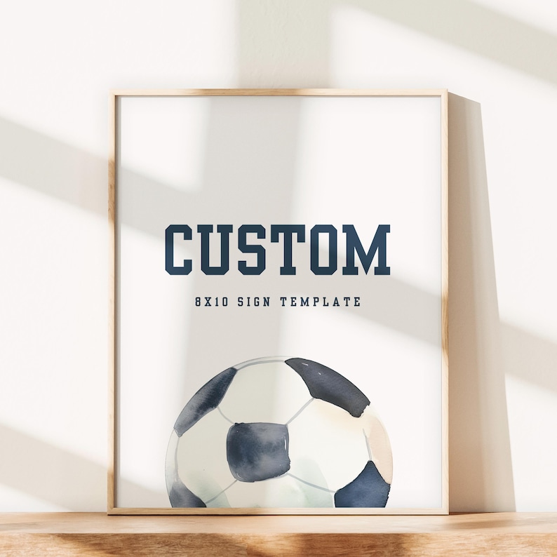 May include: A printable 8x10 sign template featuring a watercolor illustration of a soccer ball. The text "CUSTOM" is displayed in a bold, navy blue font above the soccer ball.