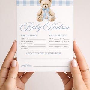 May include: A baby shower invitation card with a light blue gingham pattern at the top and a watercolor teddy bear illustration. The card includes fill-in-the-blank sections for predictions and advice, with the name "Baby Hudson" in elegant script.
