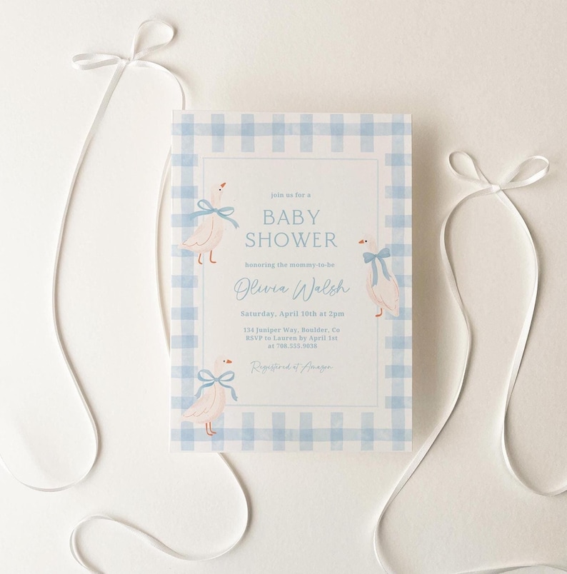 May include: A blue and white gingham baby shower invitation with a watercolor illustration of two baby ducks wearing blue bows. The invitation text reads "join us for a baby shower honoring the mommy-to-be Olivia Walsh Saturday, April 10th at 2pm 134 Juniper Way, Boulder, Co RSVP to Lauren by April 1st at 708.555.9038 Registered at Amazon"