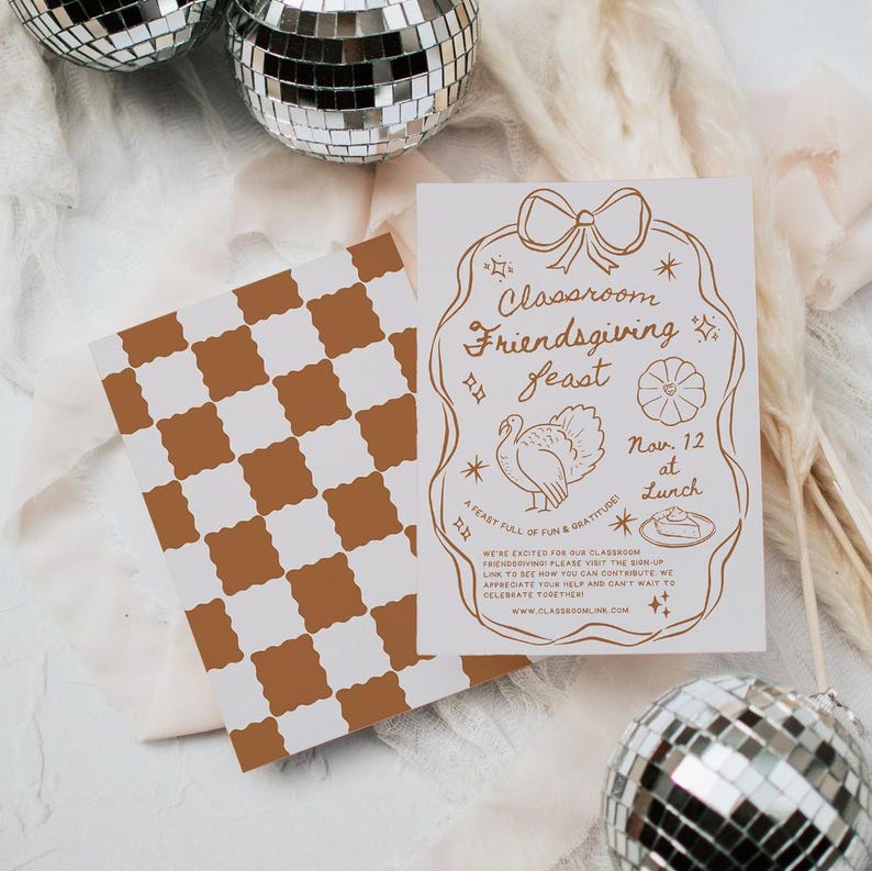 May include: A white card with a brown border and gold lettering announcing a "Classroom Friendsgiving Feast" on November 12th at lunch. The card features a turkey, a pumpkin, and a pie.