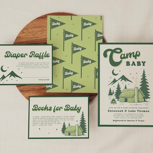 May include: A collection of baby shower invitations and inserts with a camping theme. The designs feature green and white color schemes, illustrations of mountains, cabins, and flags with the word "Baby". The text includes "Diaper Raffle" and "Books for Baby".
