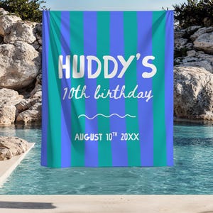May include: A rectangular fabric banner featuring vertical stripes in alternating shades of bright blue and teal. The white text reads HUDDY'S 10th birthday, followed by a horizontal wavy line and the date AUGUST 10th 20XX printed in white.