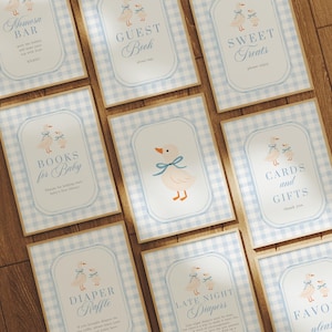 May include: A collection of baby shower signs with a light blue gingham pattern and a duckling illustration. Signs include "Mimosa Bar", "Guest Book", "Sweet Treats", "Books for Baby", "Cards and Gifts", "Diaper Raffle", "Late Night Diapers", and "Favors".
