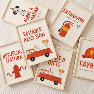 May include: A set of framed art prints with a fire station theme. The prints feature illustrations of a Dalmatian dog, fire engines, fire hydrants, and text such as "EXTINGUISH YOUR THIRST" and "ADOPT A MATIAN".