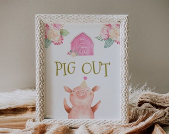 Op de afbeelding: Een wit ingelijst bord met een roze schuur, bloemen en een varken met een feestmuts. Het bord zegt "Pig Out".