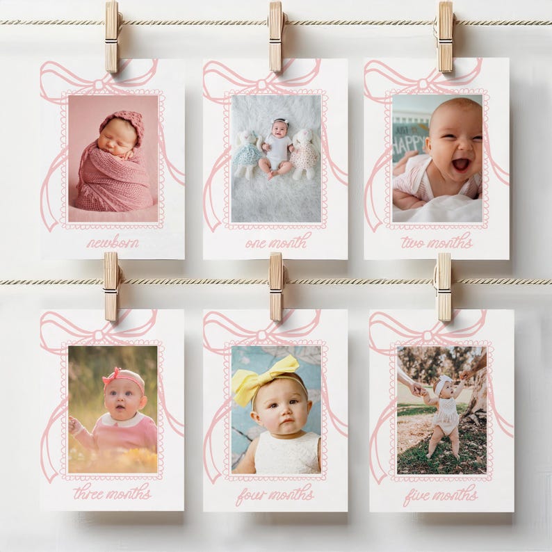 May include: A set of six baby milestone photo cards, each with a pink bow design and a photo of a baby. The cards are labeled "newborn," "one month," "two months," "three months," "four months," and "five months."