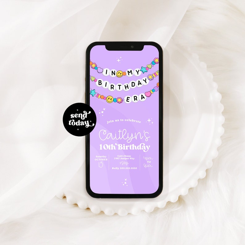 May include: Purple mobile phone screen with a birthday invitation for Caitlyn's 10th birthday. The invitation features a banner with the text "In My Birthday Era" and colorful decorations. The invitation includes the date, time, and location of the party.