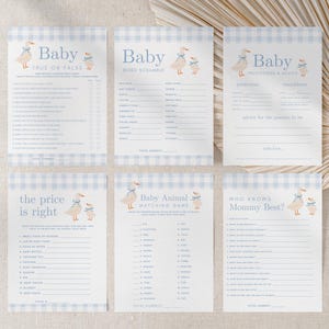 May include: A set of six baby shower game cards with a light blue gingham pattern. Each card features a duck illustration and various game titles like "True or False" and "Word Scramble".