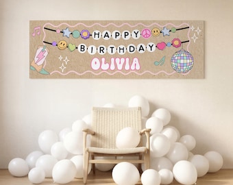 May include: A rectangular banner with a tan background featuring the text HAPPY BIRTHDAY OLIVIA in white and pink letters. The design includes illustrations of a cowboy boot, a disco ball, smiley faces, stars, flowers, and musical notes.