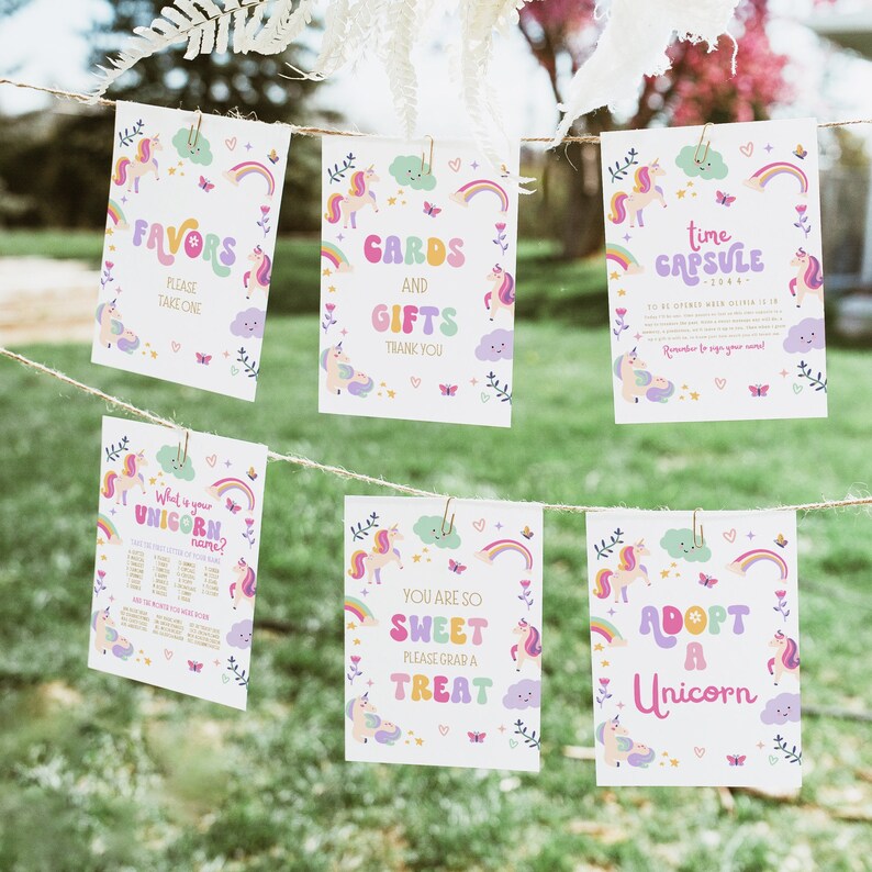 Puede incluir: Cinco carteles imprimibles con tem&aacute;tica de unicornio. Los carteles est&aacute;n decorados con arco&iacute;ris, nubes, mariposas y corazones. Los carteles dicen: "Favors, Please Take One", "Cards and Gifts, Thank You", "Time Capsule - 2044 - To be opened when Olivia is 18. Remember to sign your name!", "What is your unicorn name?", "You are so sweet, please grab a treat", and "Adopt a Unicorn".