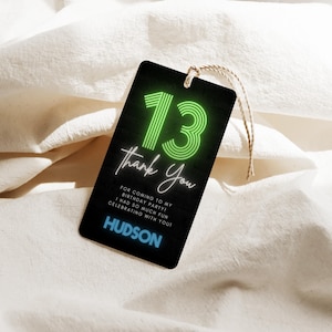 May include: Black gift tag with a neon green "13" and the words "Thank You". The tag also includes the text "For coming to my birthday party! I had so much fun celebrating with you!" and the name "HUDSON". A natural twine string is attached.