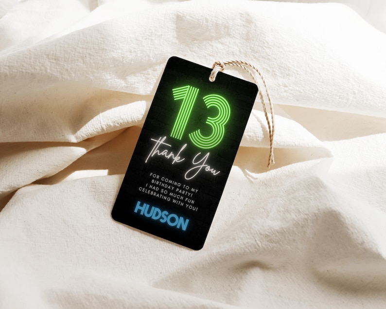 May include: Black gift tag with a neon green "13" and the words "Thank You". The tag also includes the text "For coming to my birthday party! I had so much fun celebrating with you!" and the name "HUDSON". A natural twine string is attached.