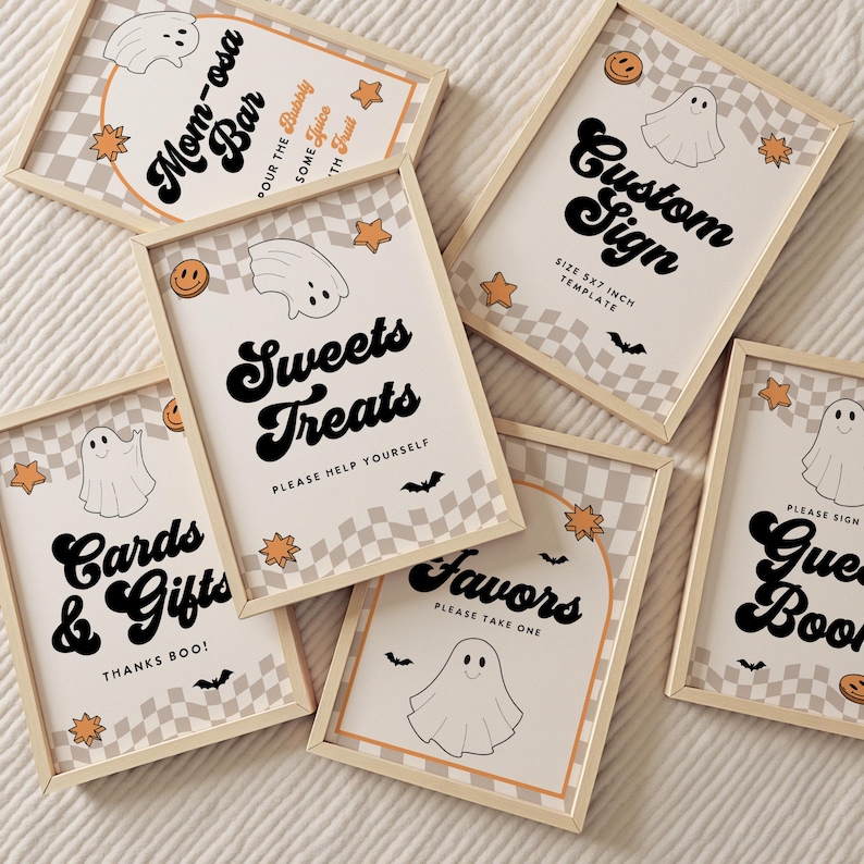 May include: A collection of framed Halloween-themed signs with a beige and white checkered background. The signs feature phrases like "Mom-osa Bar," "Sweets Treats," and "Cards & Gifts" in a retro font, along with ghost and star illustrations.