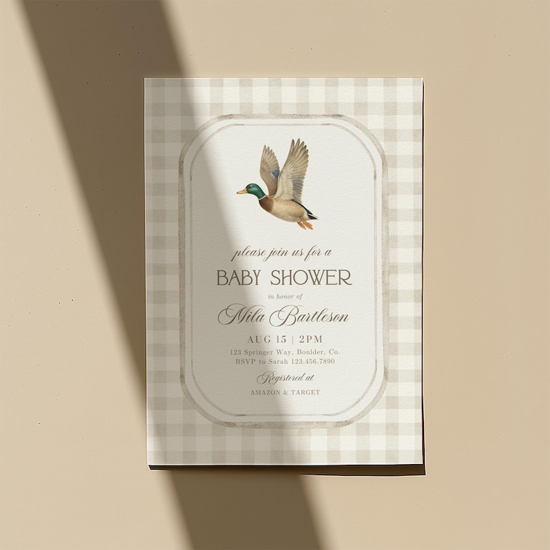 May include: Baby shower invitation with a flying duck illustration. The invitation features the text "please join us for a BABY SHOWER in honor of Mila Bartleson". The date and time are August 15 at 2 PM. The invitation is on a beige and white checkered background.