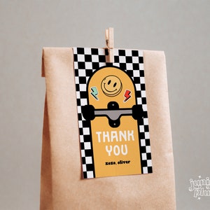 May include: A yellow and black thank you tag with a skateboard design. The tag has a smiley face, lightning bolts, and the text "Thank You" with "xoxo, oliver" below.