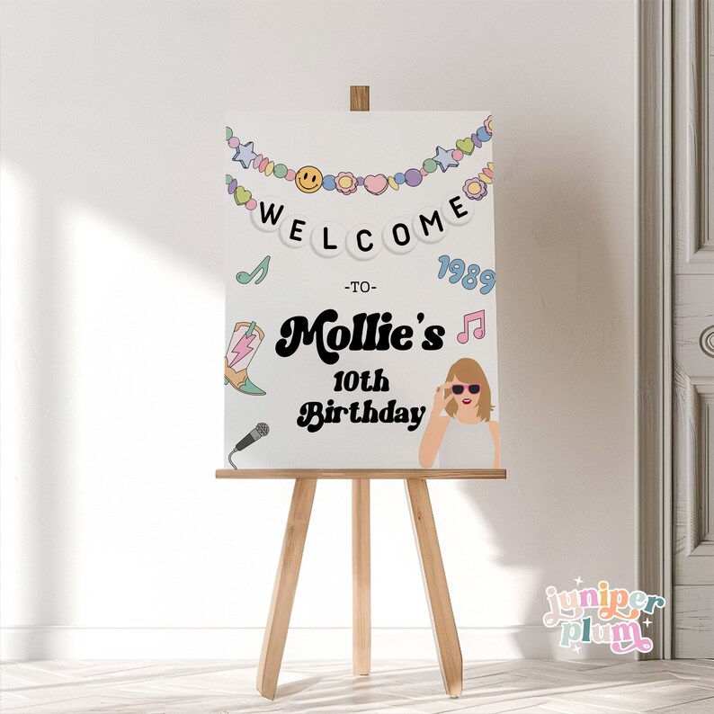 May include: Welcome to Mollie's 10th Birthday party sign with a colorful banner, a microphone, a cowboy boot, a music note, and a cartoon image of Taylor Swift. The sign is on an easel.