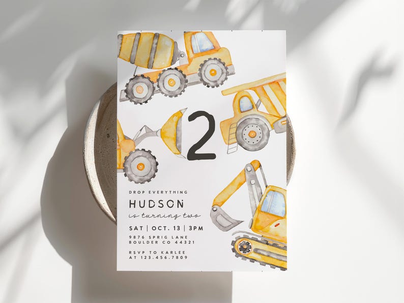 May include: A watercolor-style birthday invitation featuring construction vehicles in shades of yellow and gray. The number "2" is prominently displayed, with event details below, including the name "HUDSON" and RSVP information.