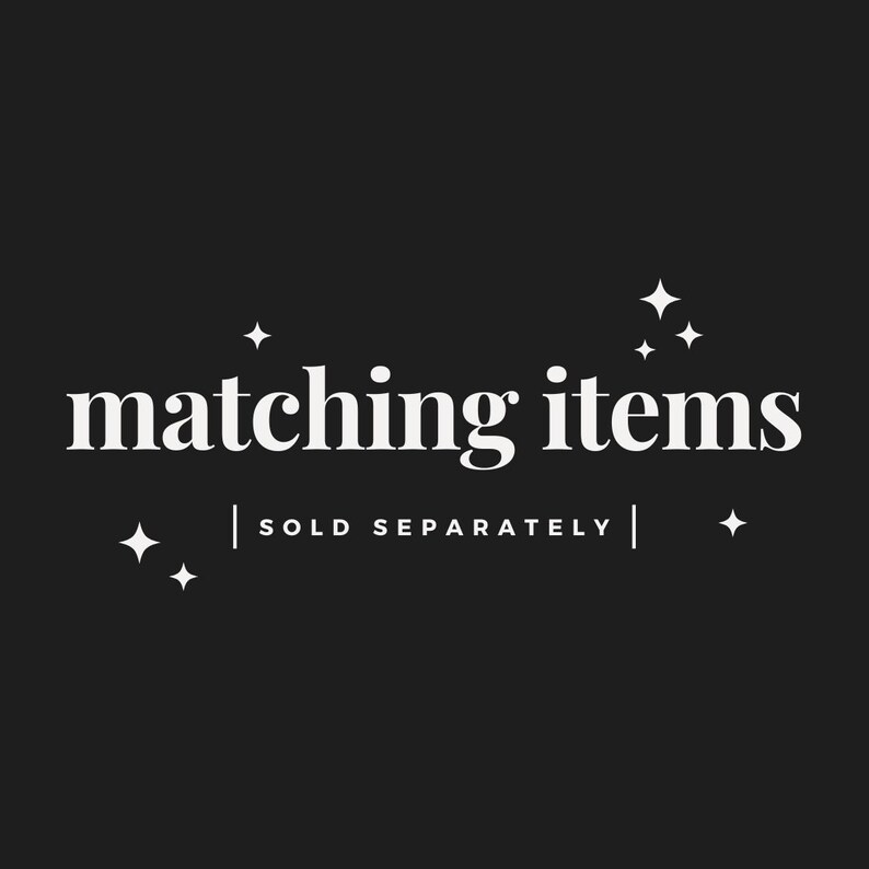 May include: Black background with white text that reads "matching items" in a serif font. Below the text is "| SOLD SEPARATELY |" in a sans-serif font. White starburst graphics are in each corner.