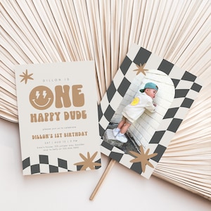 May include: A tan and brown birthday invitation with a chequered pattern and a photo of a child wearing a white shirt and a blue cap. The invitation reads "Dillon is One Happy Dude" and includes the date, time, and location of the party.