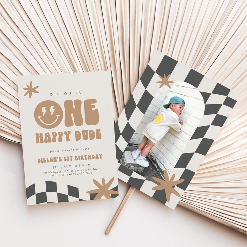 May include: A tan and brown birthday invitation with a chequered pattern and a photo of a child wearing a white shirt and a blue cap. The invitation reads "Dillon is One Happy Dude" and includes the date, time, and location of the party.