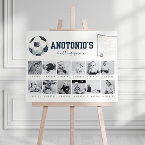 May include: A white poster with a soccer ball graphic and the text "ANTONIO'S hall of fame". The poster features 12 black and white photos of a baby boy at different ages, from 1 month to 12 months.