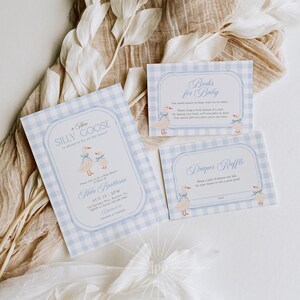 May include: Baby shower stationery set featuring a light blue gingham pattern. The set includes invitations and cards with a whimsical goose illustration. The text on the invitation reads "A New Silly Goose is about to be on the loose!"