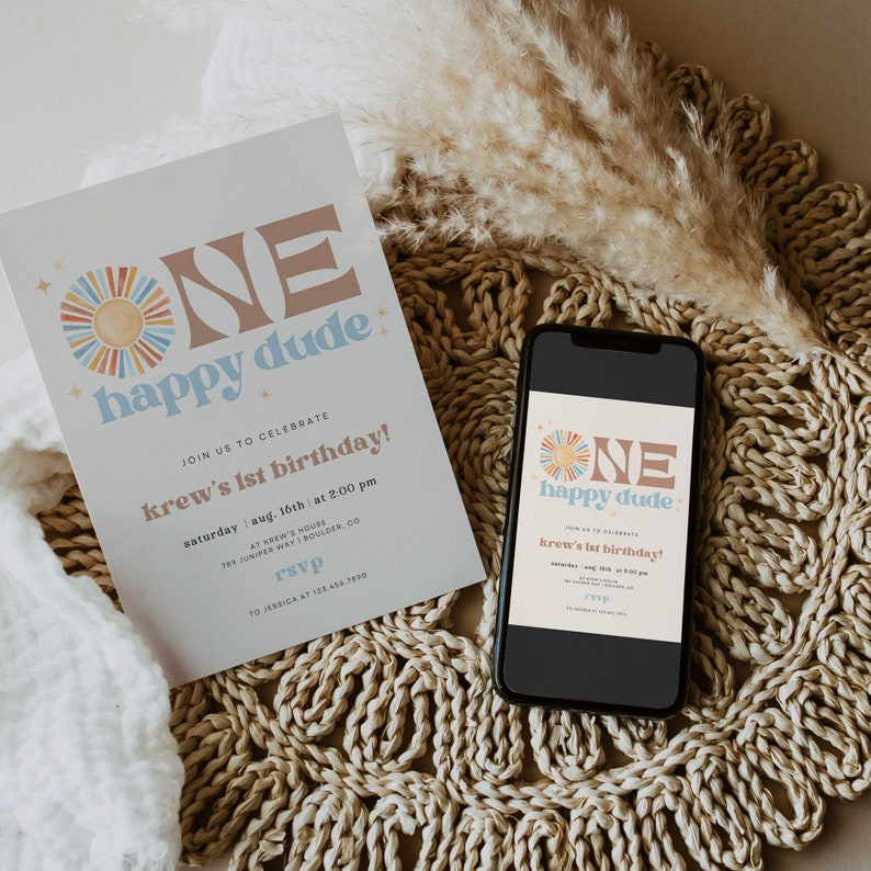May include: A birthday invitation with the text "ONE happy dude" in a retro font, featuring a sun graphic. The invitation is on a white background with details about the party, and a smartphone displays the same design.