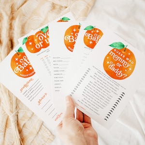 May include: A set of printable baby shower games with an orange and white color scheme. The games include "Guess Who Mommy or Daddy?" and "Over or Under Baby Predictions".