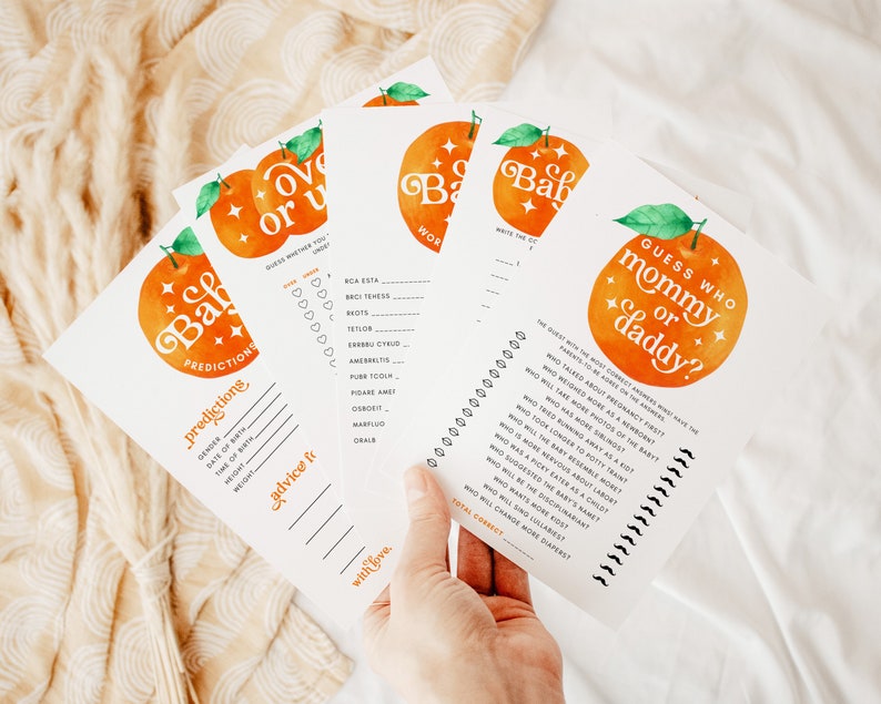 May include: A set of printable baby shower games with an orange and white color scheme. The games include "Guess Who Mommy or Daddy?" and "Over or Under Baby Predictions".