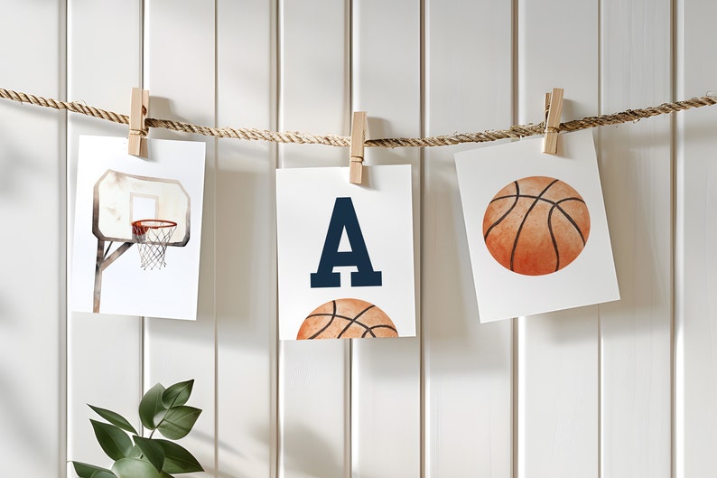 May include: Three printable cards with a basketball theme. The first card shows a basketball hoop with a basketball in it. The second card has the letter A in navy blue with a basketball underneath. The third card shows a basketball.