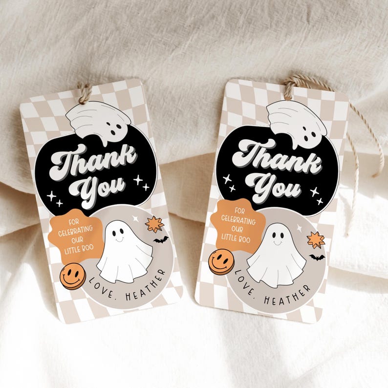 May include: Two rectangular gift tags with a beige and white checkered pattern. Each tag features a black oval with the words "Thank You" in white, a ghost illustration, and the text "For Celebrating Our Little Boo."