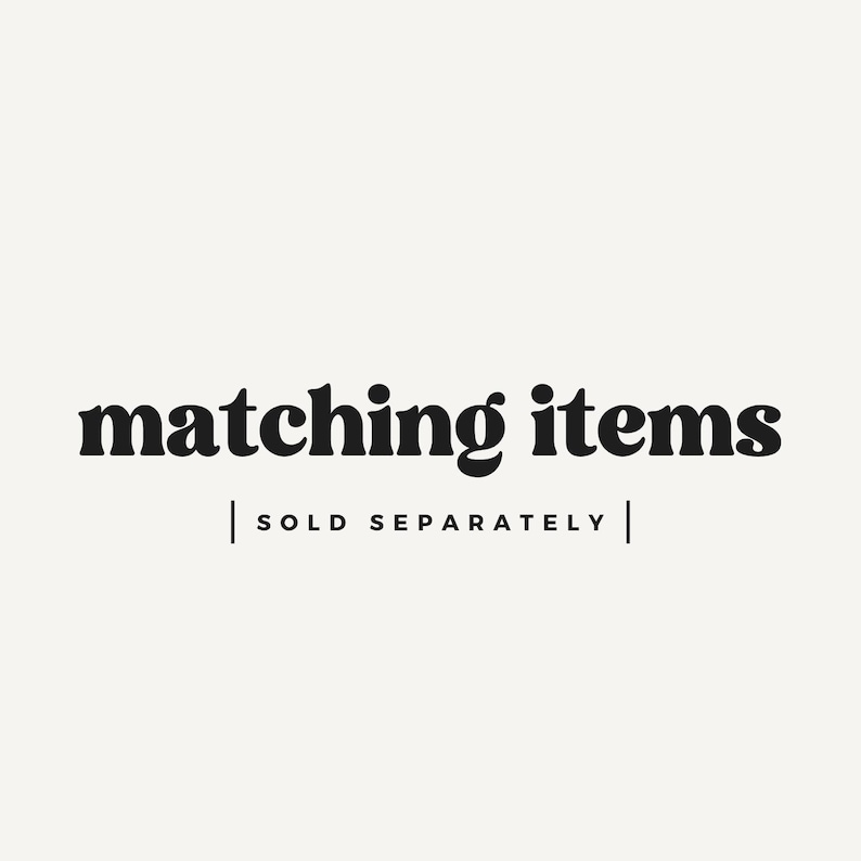 May include: Image with the text "matching items" in a bold, black font. Below the text is a line, followed by the text "SOLD SEPARATELY" in a smaller, black font. The background is a solid, off-white color.