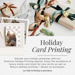 May include: An advertisement for holiday card printing. The image shows wrapped gifts with ribbons, decorative bells, and a holiday card with a photo of a child. The card has the text "HAPPY HOLIDAYS".
