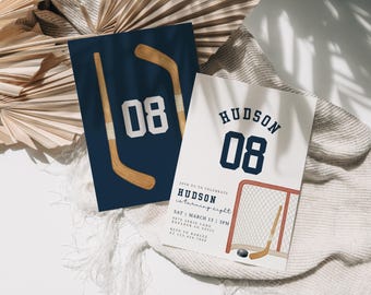 May include: Two hockey-themed birthday invitations. One navy blue card features a hockey stick and the number 08. The other invitation is white with the name "Hudson" and the number 08, plus a hockey net and puck.