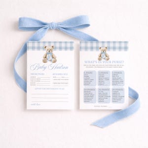 May include: Baby shower game cards with a blue gingham border and a teddy bear illustration. The cards include prompts for predictions and a "What's in Your Purse?" game, tied with a blue ribbon.