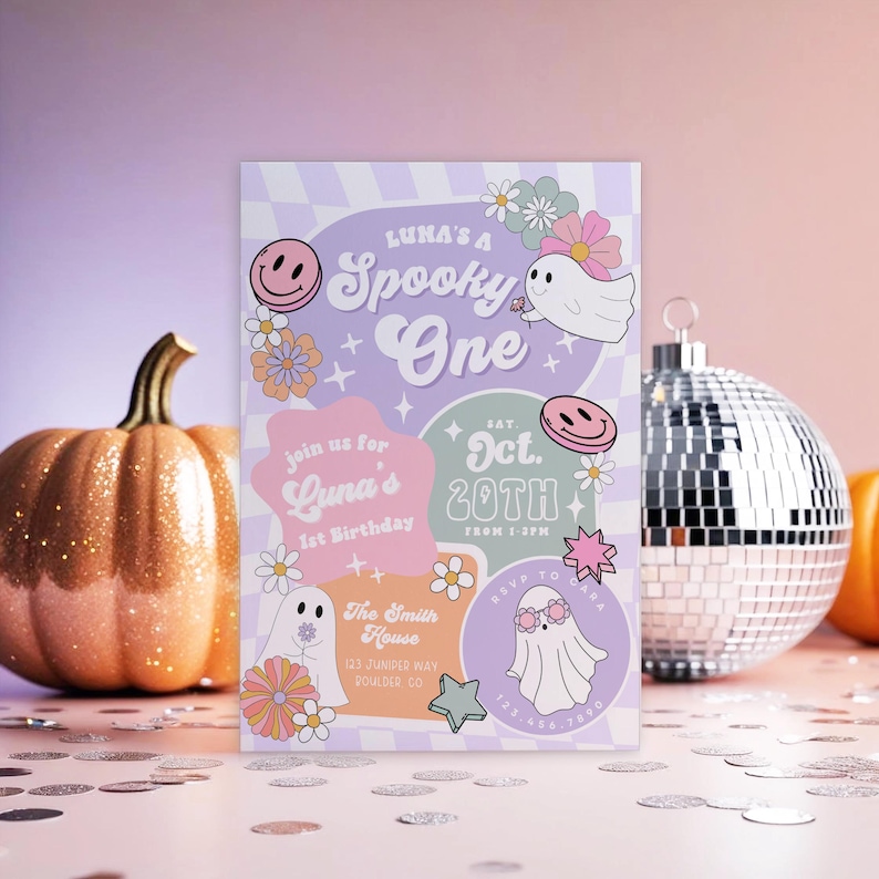 May include: A Halloween-themed invitation with the text "Luna's a Spooky One" in purple and white. The invitation includes illustrations of ghosts, flowers, and a smiley face. A glittery orange pumpkin and a disco ball are in the background.