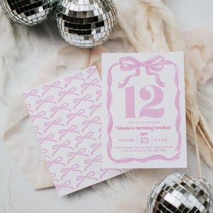 May include: Pink and white birthday party invitation with a bow design. The invitation features the number 12, the text "Annie's turning twelve!", and event details. A matching card with a bow pattern is also visible.