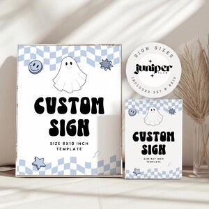 May include: White custom sign with a blue checkered background, a smiling face, a ghost, and star graphics. The sign reads "CUSTOM SIGN" and "SIZE 8x10 INCH TEMPLATE". A smaller sign and a round sticker with the text "juniper plum" are also visible.