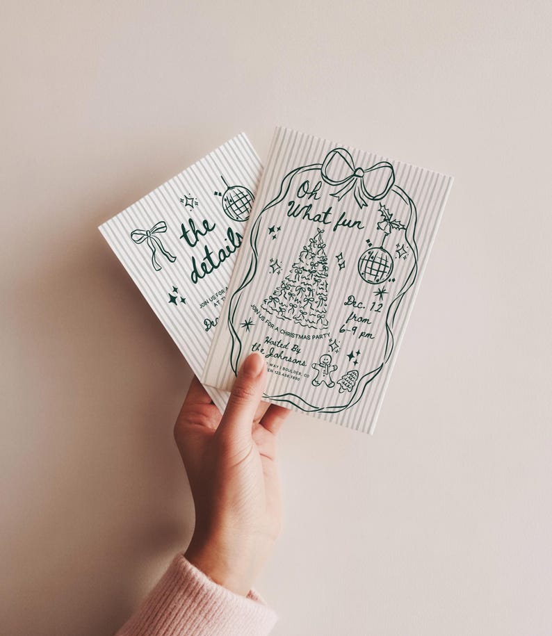 May include: Two Christmas party invitations with green line art on a striped background. One invitation says "the details" and the other says "Oh What fun" with a Christmas tree and disco ball illustration. The invitations are held by a person.