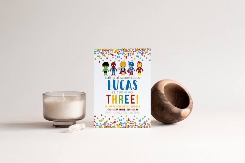 May include: A colorful invitation with a confetti background. It says "calling all superheroes Lucas is turning THREE!" with a date and RSVP information.
