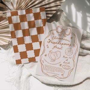 May include: A light brown and white checkered background with a white card on top. The card has a brown illustration of a turkey, a pie, and a bow. The text on the card reads "Classroom Friendsgiving Feast" and "Nov. 12 at Lunch".