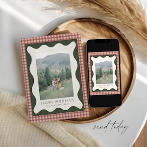 May include: A holiday card and a smartphone displaying the same image. The card features a family photo within a white wavy frame, set against a green border and a red and white checkered pattern. The text reads "HAPPY HOLIDAYS" and "THE WILKINSON FAMILY".