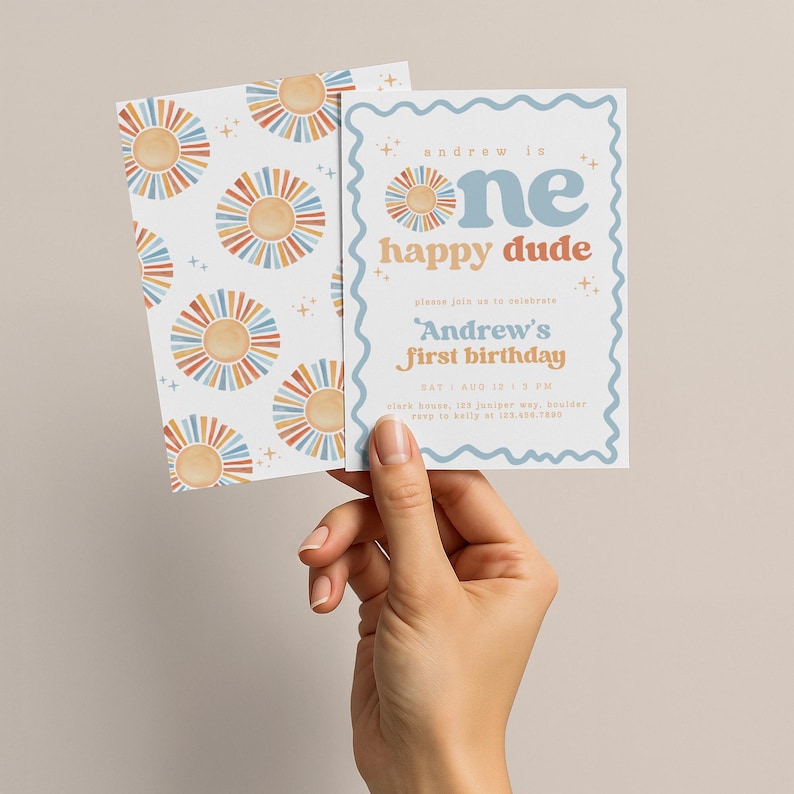 May include: A set of two invitation cards. One card features a repeating pattern of watercolor suns in orange, blue, and yellow. The other card has text that reads "Andrew is one happy dude" and "Andrew's first birthday".