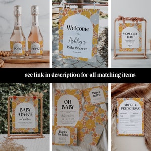 May include: A set of printable baby shower decorations with a retro floral design. The decorations include a welcome sign, a mom-osa bar sign, a baby advice and predictions card, a diaper raffle card, and a 'Oh Baby' invitation. The decorations are in shades of yellow, orange, and blue.