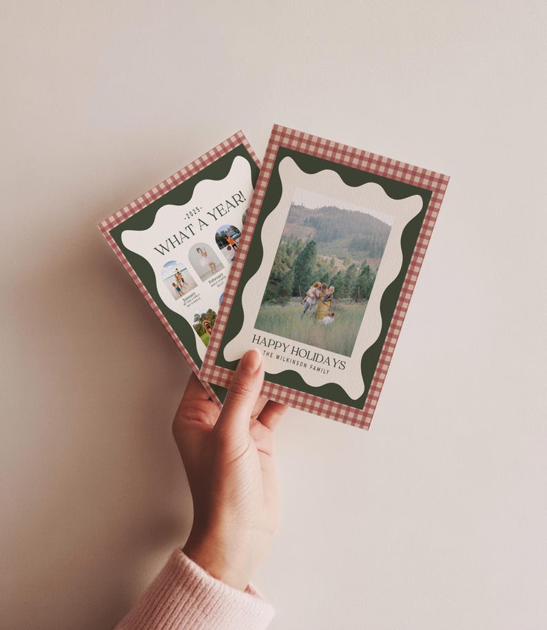 May include: Two holiday cards with a green and red gingham border. One card reads "WHAT A YEAR!" with photos. The other card says "HAPPY HOLIDAYS" with a family photo. The cards have a scalloped edge.