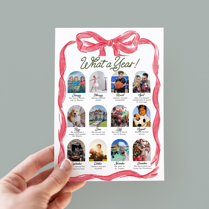 May include: A personalised photo print with a red ribbon design, titled "What a Year!". The print displays twelve small photos, each representing a month, with captions below. The print is held by a hand.