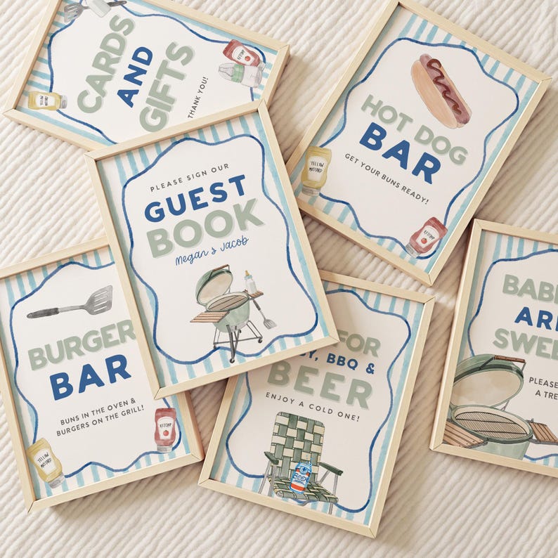May include: A collection of framed signs with watercolor illustrations and text for a barbecue. Signs include "Cards and Gifts", "Guest Book", "Burger Bar", "Hot Dog Bar", "For BBQ & Beer", and "Babies are Sweet". Each sign has a light wood frame.