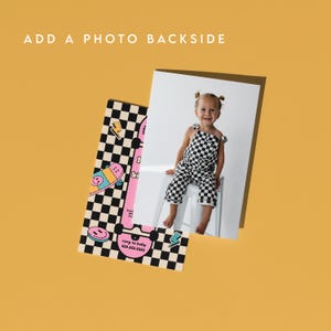 May include: A pink and blue skateboard graphic with a checkered background. The text "Happy Birthday" is on the skateboard. The text "RSVP to Kelly 555.555.5555" is at the bottom of the card. A photo of a child wearing a black and white checkered jumpsuit is in the background.
